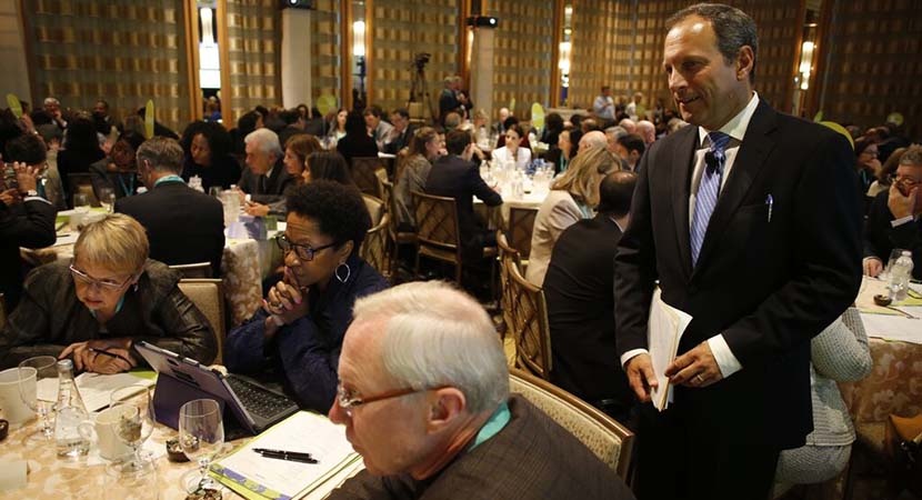 Scott Westfahl (r), Director of Executive Education at Harvard Law School, interacts with LCLD Board Member Mark Roellig (c), General Counsel at MassMutual, and other Members at the 2015 Annual Membership Meeting. (Photo by Joe Mahoney)