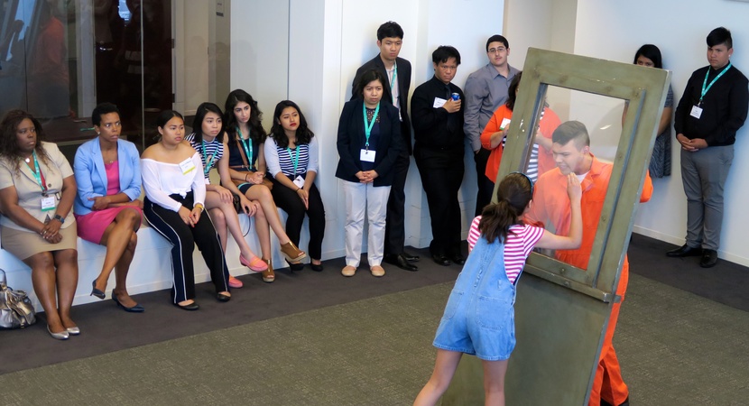 Students with Chicago's inner-city Albany Park Theater Project perform a one-act play about the threat of deportation, after a community service session in which Alumni taught networking skills to the students. (Photo by Don Belt)