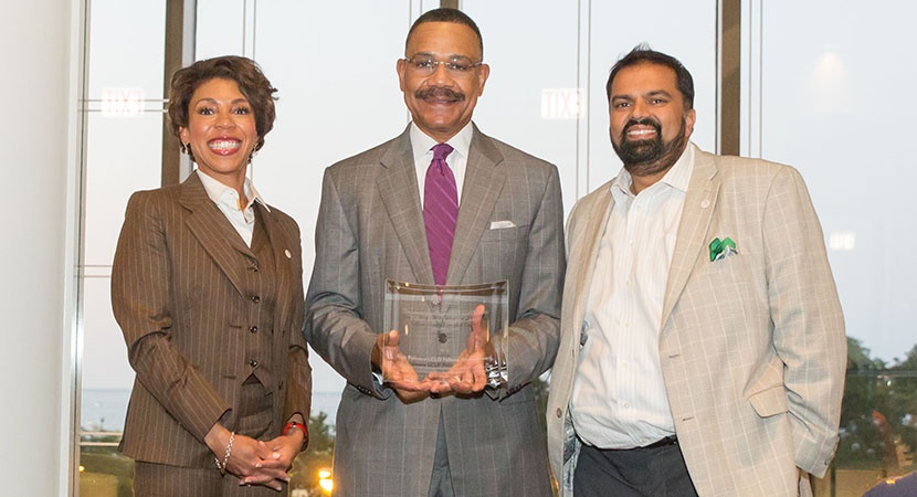 LCLD Founding Chair Emeritus Rick Palmore (c) presents 2012 Fellow Yvette Gatling and 2011 Fellow Kamran Khan with the 2016 Rick Palmore LCLD Fellows Alumni Award. (Photo by Jay Haas)