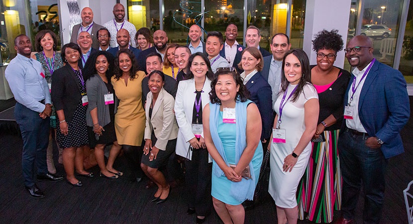 Members of the Fellows Alumni Class of 2018 with the "Participation is Key" Award for "All In!" Campaign contributions, 2019. (Photo by Jay Haas)