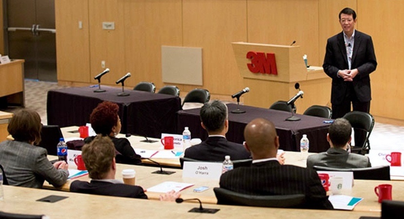 Ivan Fong, General Counsel of 3M, addresses the Fellows during a day-long visit to the company's headquarters in St. Paul, Minnesota. (Photo by Jay Haas)